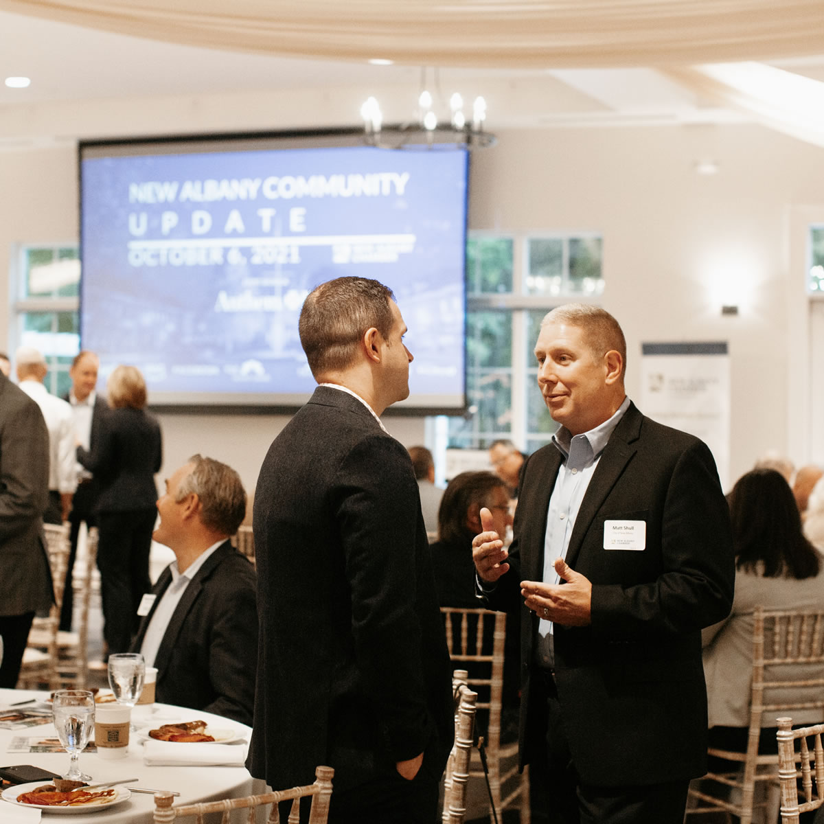 Business leaders networking at corporate event