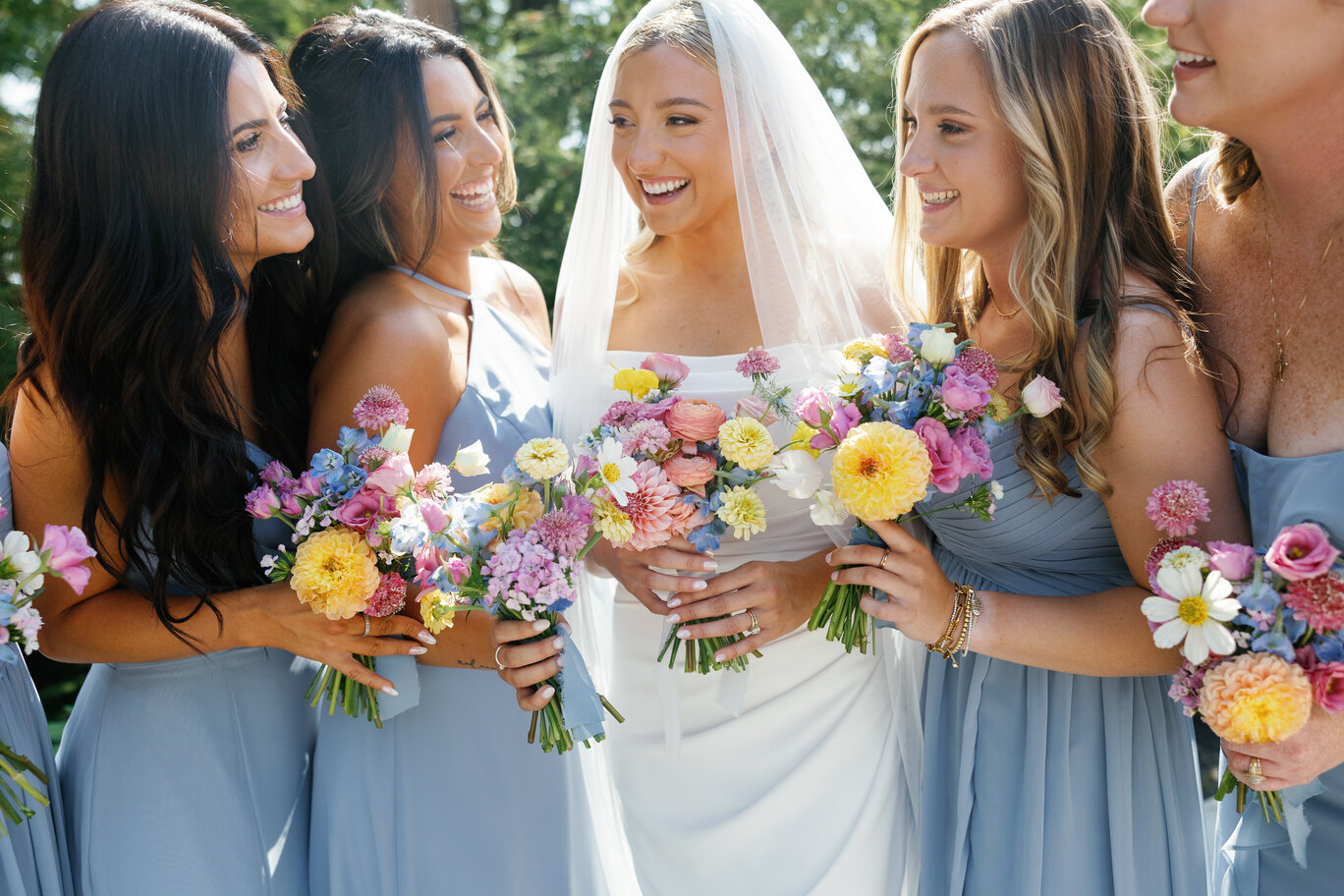 Bride and bridesmaids smiling