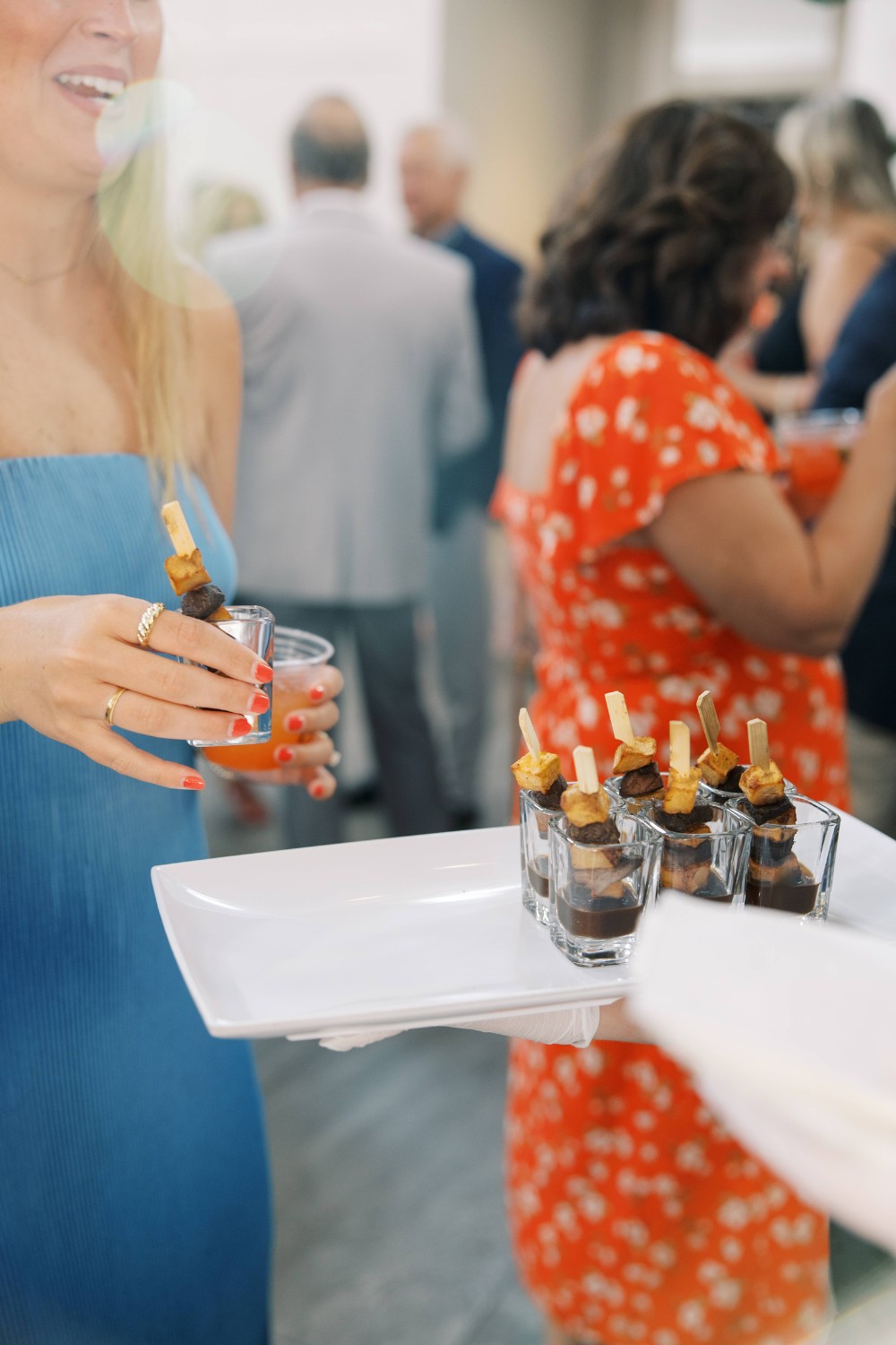 Corporate event guest enjoying passed appetizers served in shot glasses during cocktail hour at The Estate at New Albany.