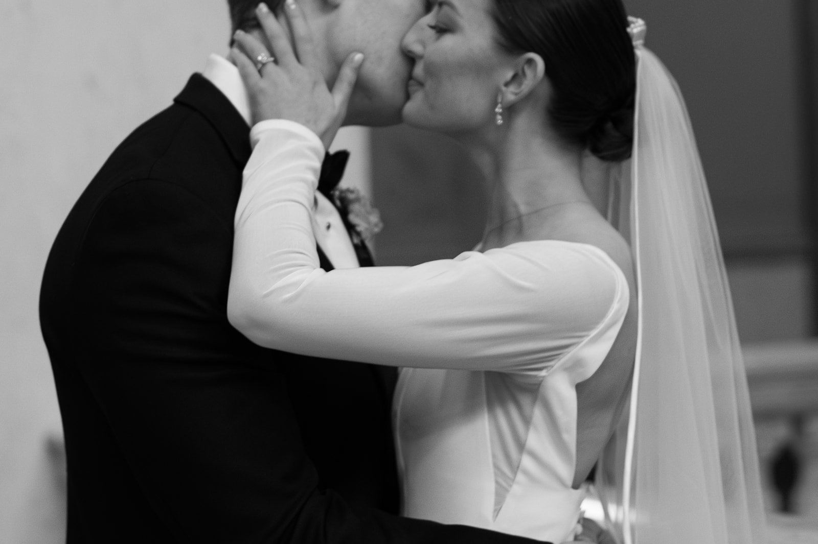 Bride and groom black and white kiss photo